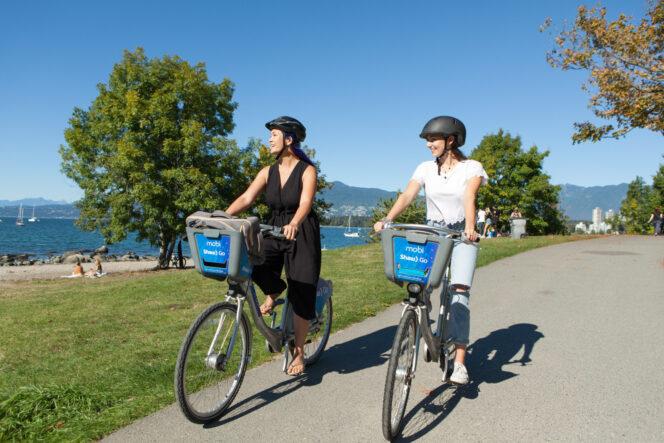 Two people ride Mobi bike share
</p><p>→ Continue reading at <a target='_blank' rel=